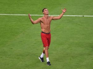 Cristiano Ronaldo celebrates after the EURO 2016 final while giving the world a snap of his CR7 underwear. Photo credit: Joe Giddens/PA Wire.